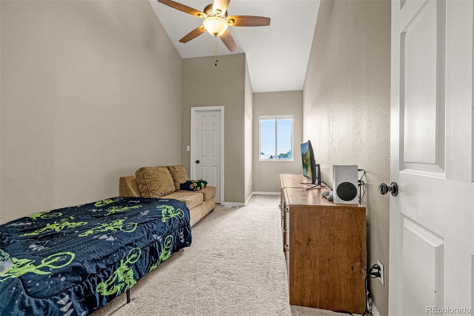 3115 Canyon Heights Road Pueblo, CO 81005 - Photo 23 of 44 a bedroom with bed and window