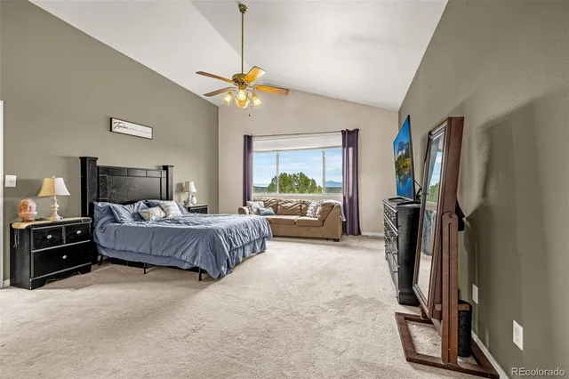 a bedroom with a bed dresser and a window