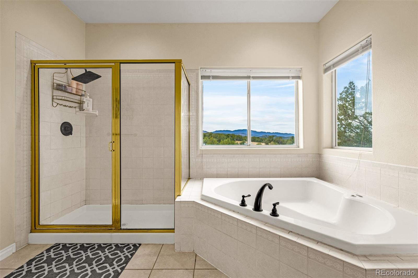 3115 Canyon Heights Road Pueblo, CO 81005 - Photo 27 of 44 a bathroom with a bathtub and a shower