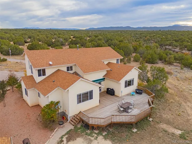 an aerial view of a house with a garden