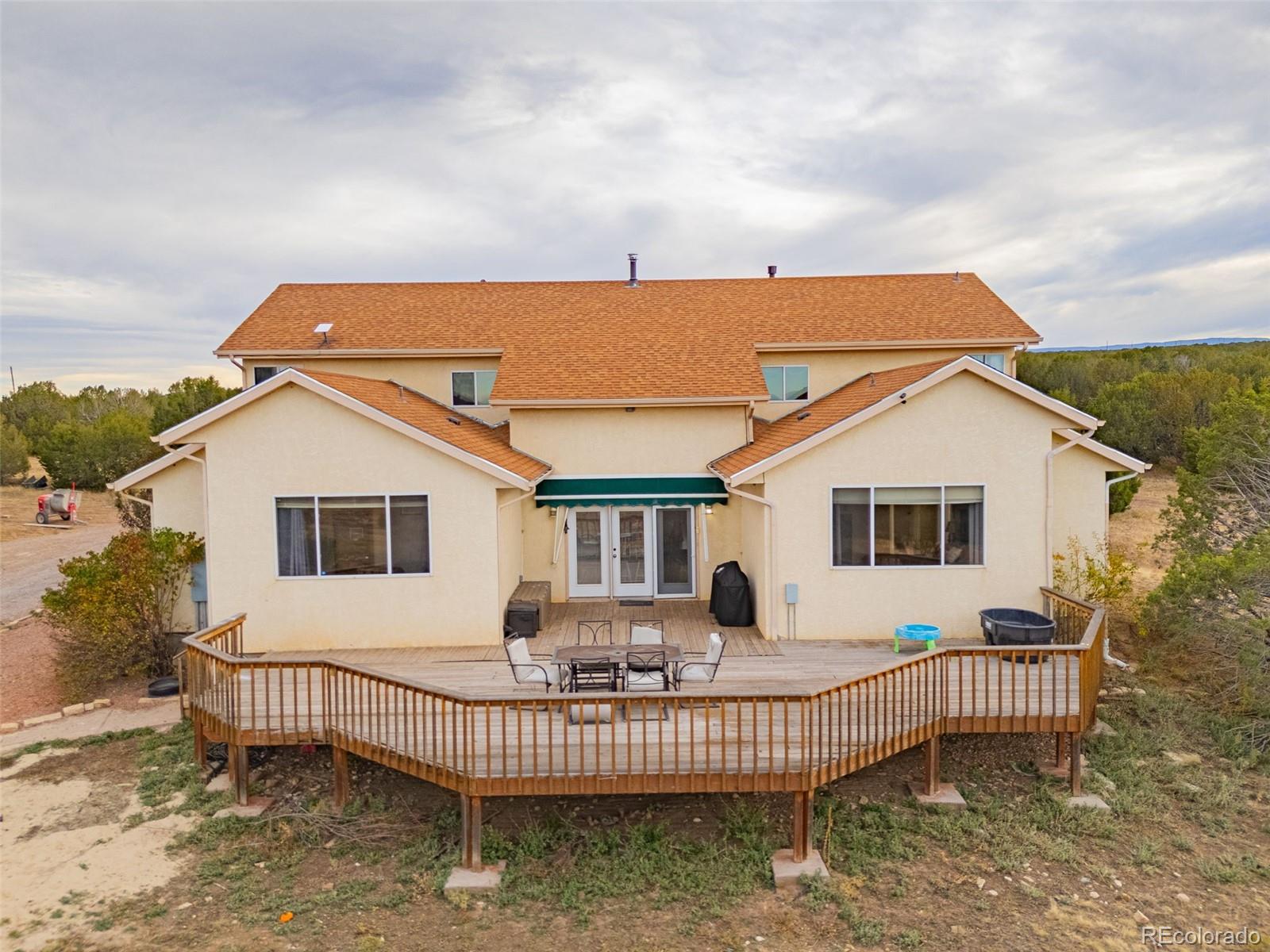 3115 Canyon Heights Road Pueblo, CO 81005 - Photo 36 of 44 front view of a house with a yard