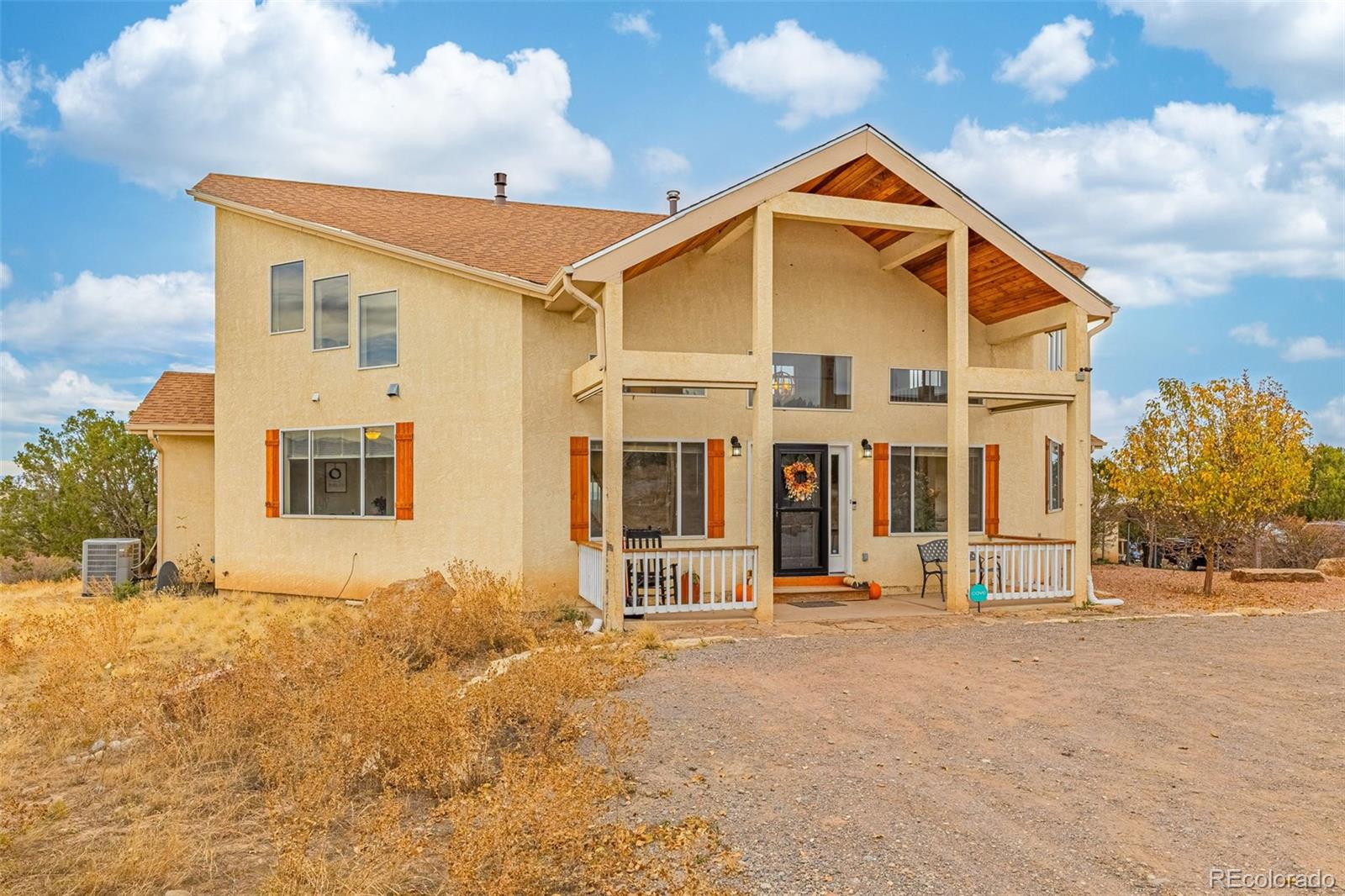 3115 Canyon Heights Road Pueblo, CO 81005 - Photo 39 of 44 a front view of a house with a outdoor space