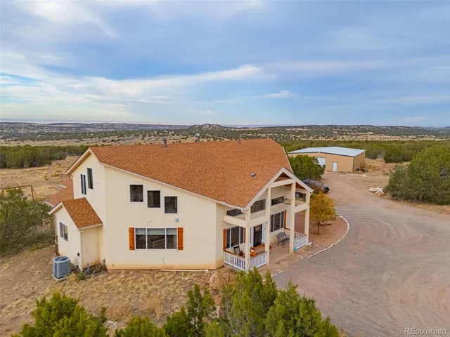 an aerial view of a house with a garden space