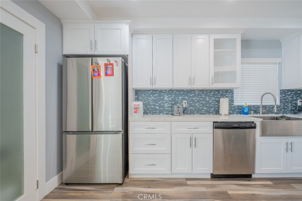 6436 Day Street Tujunga, CA 91042 - Photo 12 of 38 a kitchen with stainless steel appliances granite countertop a refrigerator sink and cabinets