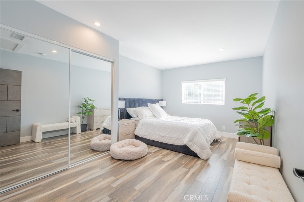 6436 Day Street Tujunga, CA 91042 - Photo 6 of 38 a spacious bedroom with a bed and a table