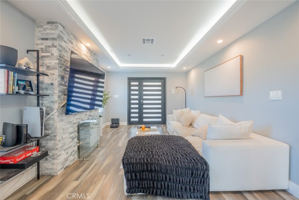 6436 Day Street Tujunga, CA 91042 - Photo 8 of 38 a bedroom with a bed and a couch