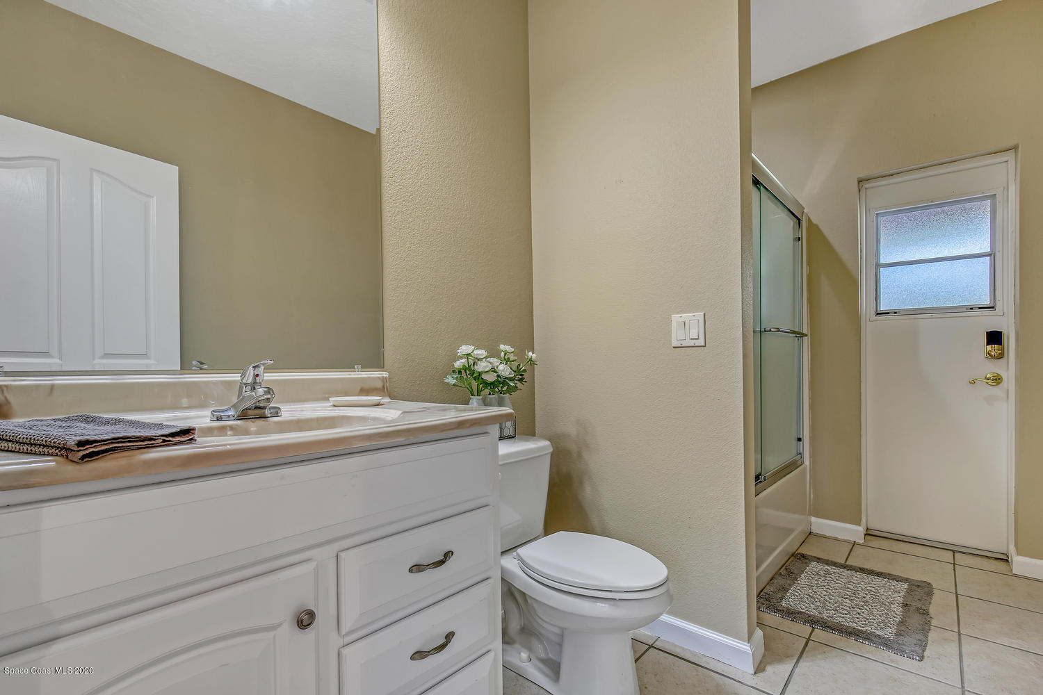 1290 Adamson Road Cocoa, FL 32926 - Photo 31 of 38 2nd Full Bathroom With Door To The Back