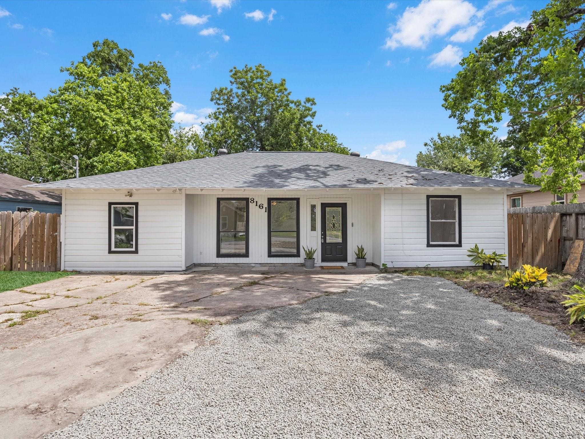 front view of a house and a yard