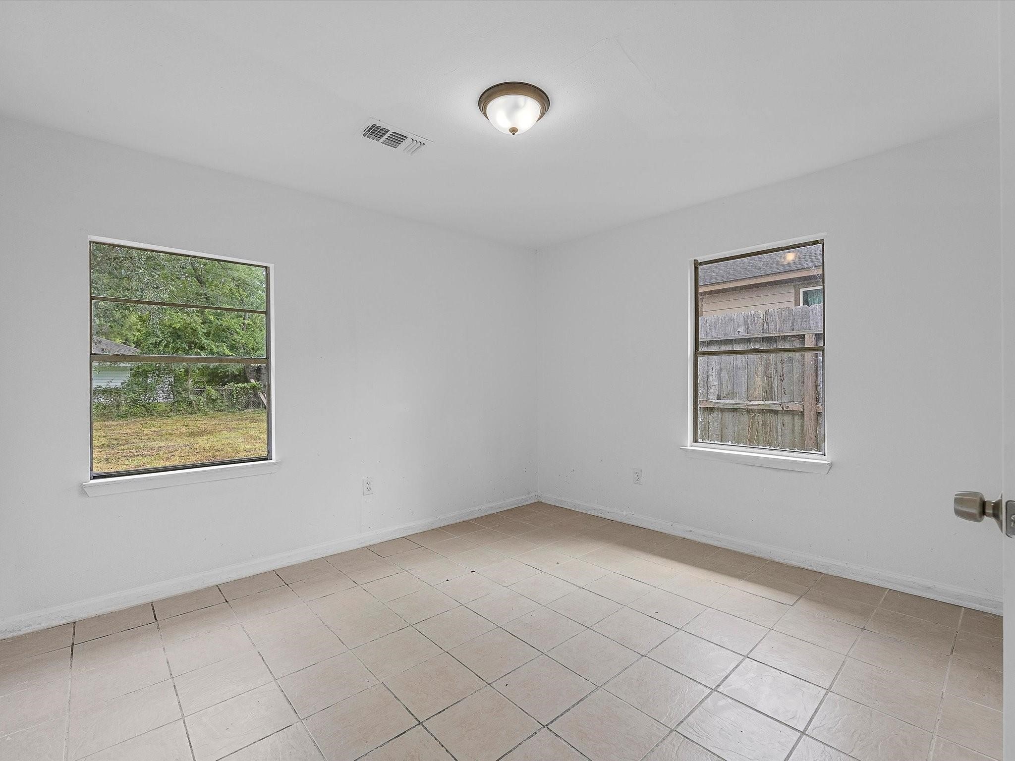 8161 Record Street Houston, TX 77028 - Photo 8 of 12 a view of an empty room with a window