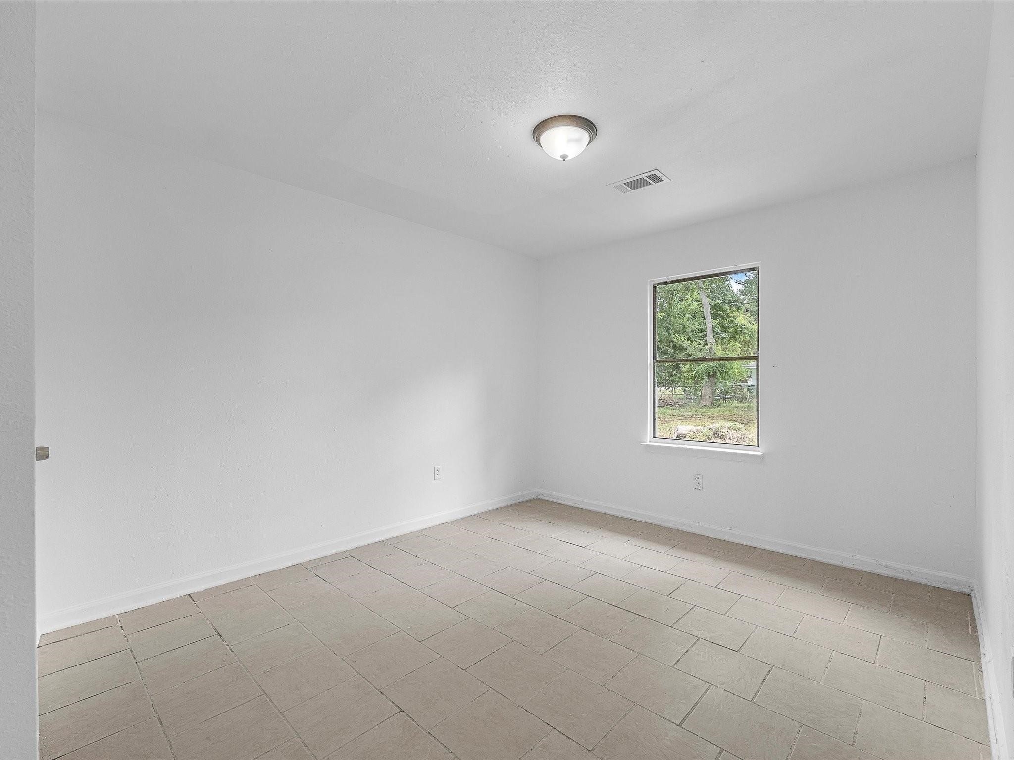 8161 Record Street Houston, TX 77028 - Photo 9 of 12 an empty room with a window
