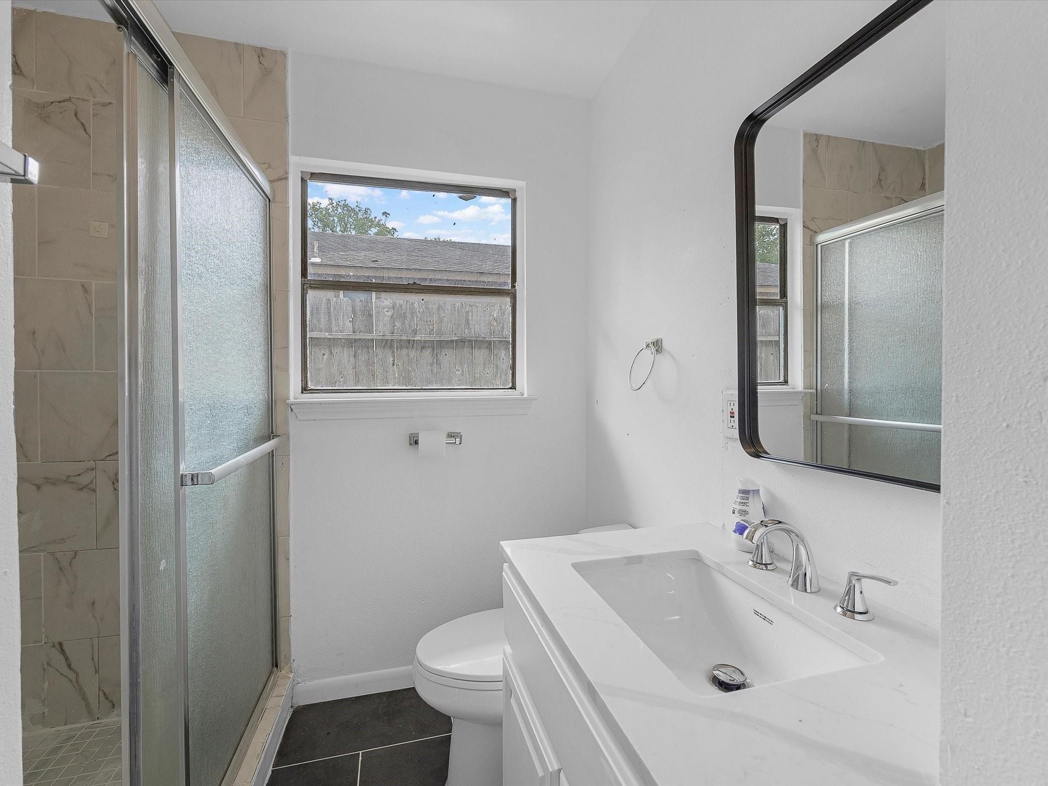 8161 Record Street Houston, TX 77028 - Photo 10 of 12 a bathroom with a sink toilet and shower