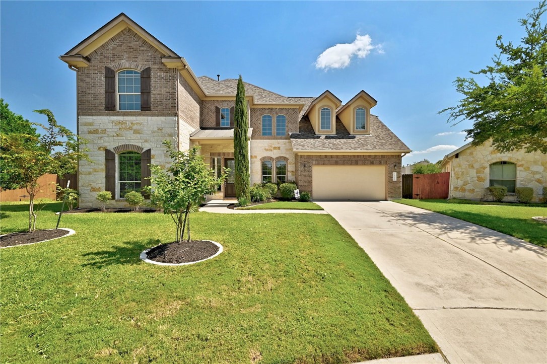 a front view of a house with a yard