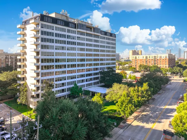 a view of a city with tall buildings