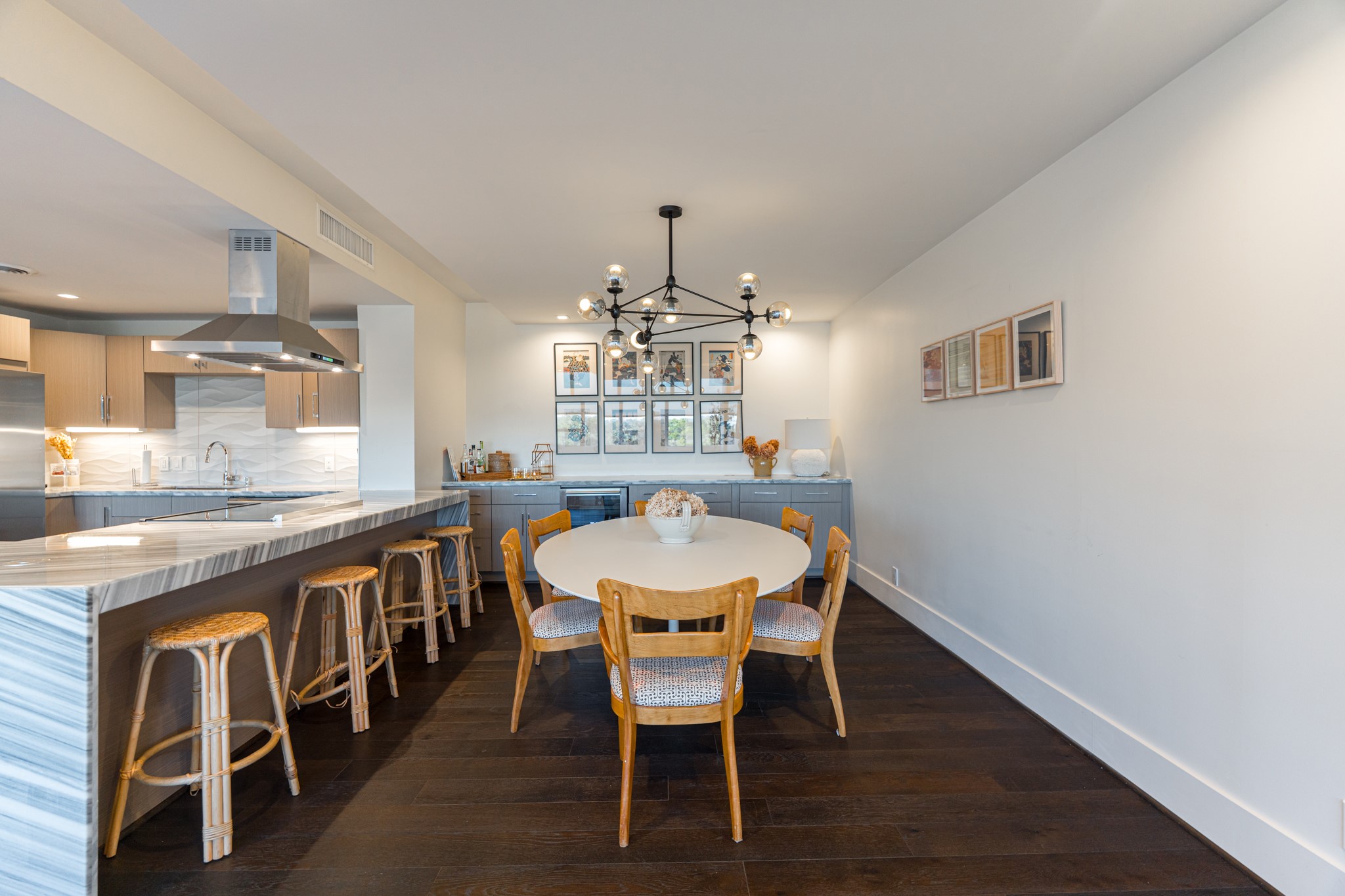 2701 Westheimer Road, Unit 6F Houston, TX 77098 - Photo 20 of 45 a dining room with furniture a chandelier and wooden floor