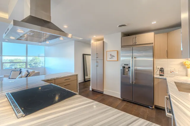 a view of hallway with wooden floor