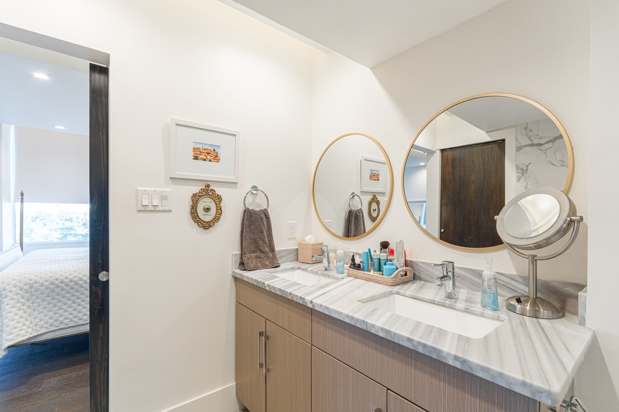 2701 Westheimer Road, Unit 6F Houston, TX 77098 - Photo 35 of 45 a bathroom with a granite countertop sink mirror and vanity
