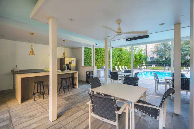 a view of a swimming pool with a patio