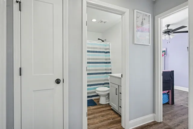 a bathroom with a shower and a toilet