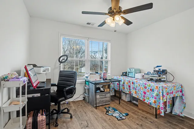 a bedroom with furniture and a window