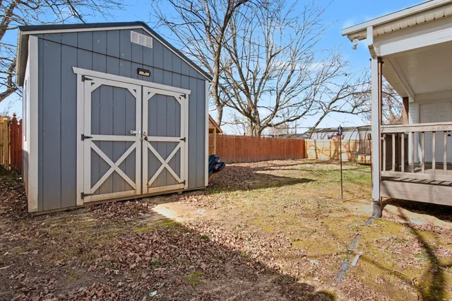 a view of outdoor space with wooden fence