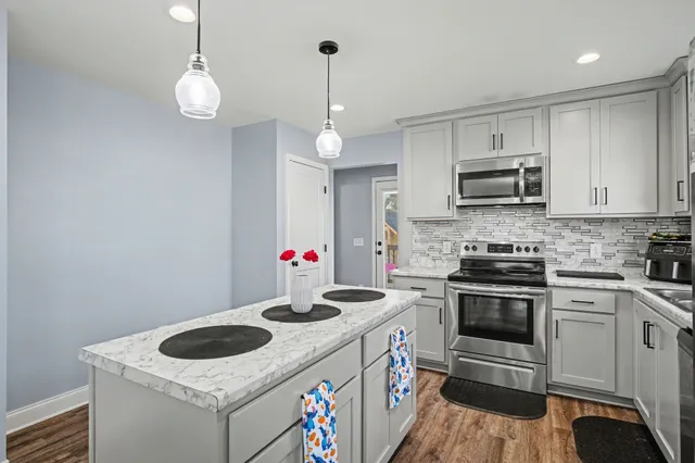 a kitchen with a stove and a microwave