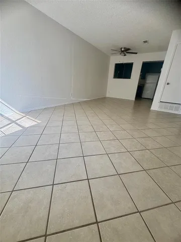 a view of an empty room and entryway