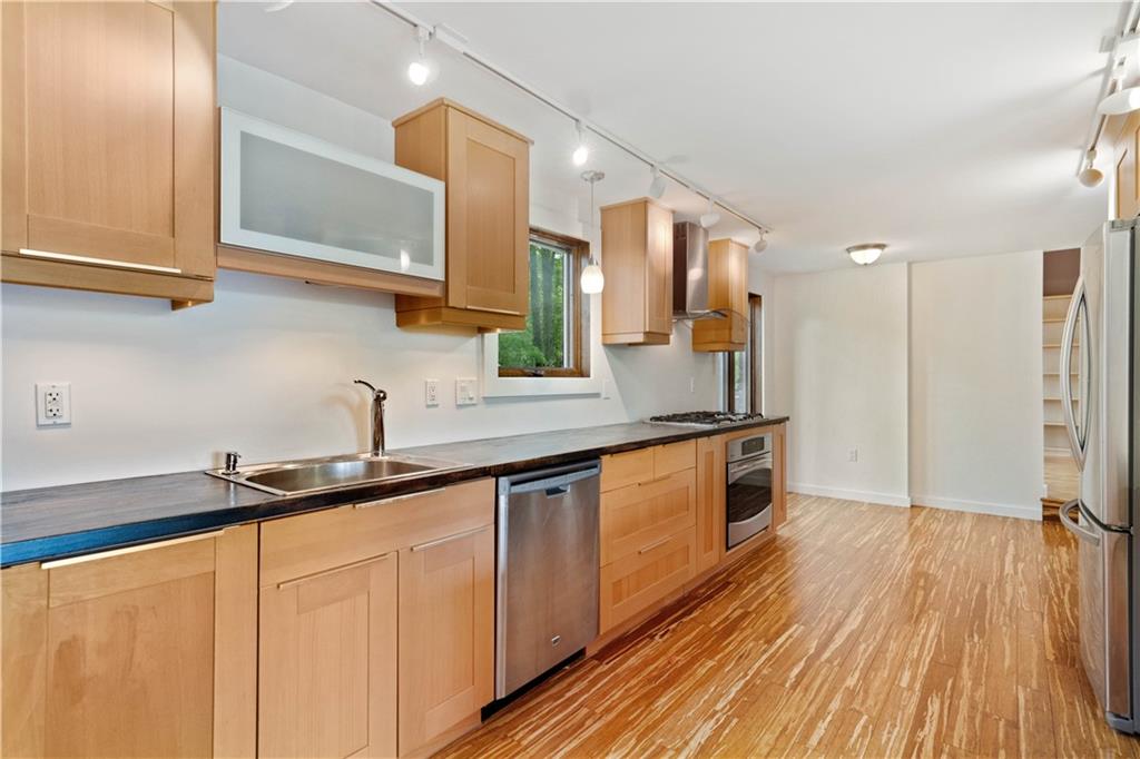 150 Ridge Avenue Pittsburgh, PA 15237 - Photo 6 of 25 a kitchen with stainless steel appliances granite countertop a sink and cabinets