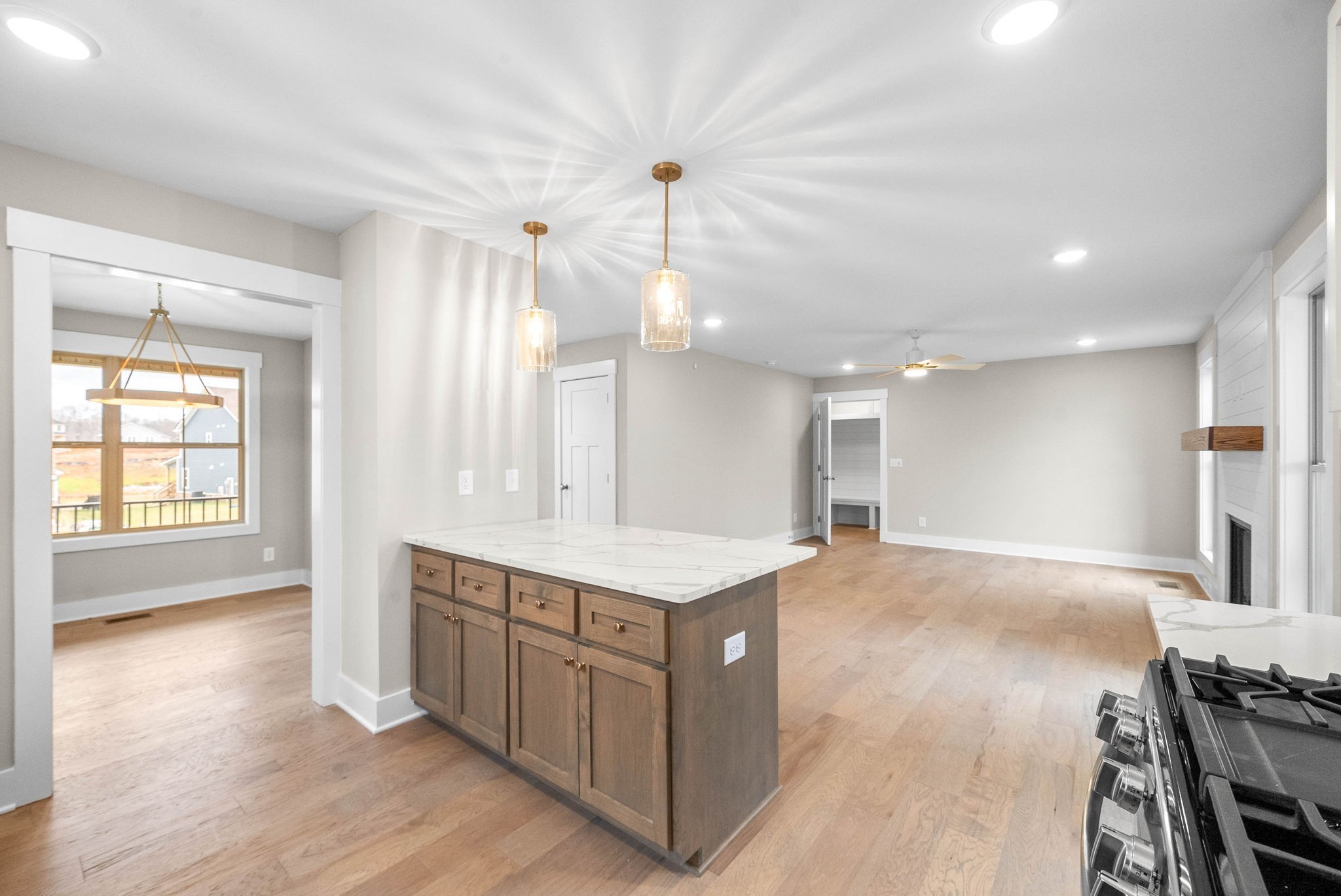 1592 Collins View Way Clarksville, TN 37043 - Photo 14 of 32 a view of a kitchen center island wooden floor and windows