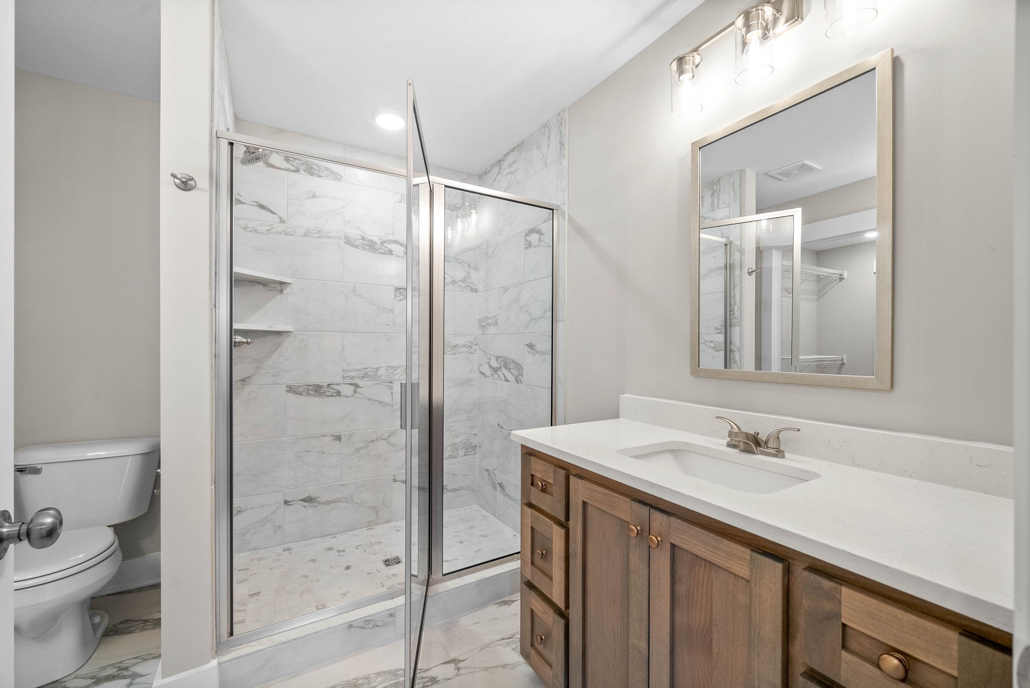 1592 Collins View Way Clarksville, TN 37043 - Photo 21 of 32 a bathroom with a sink a toilet and shower