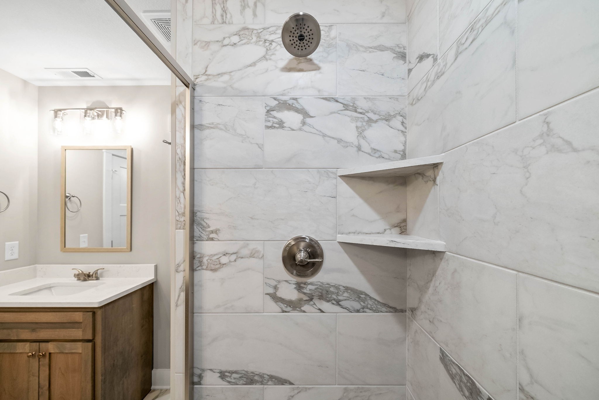 1592 Collins View Way Clarksville, TN 37043 - Photo 22 of 32 a bathroom with a sink and mirror