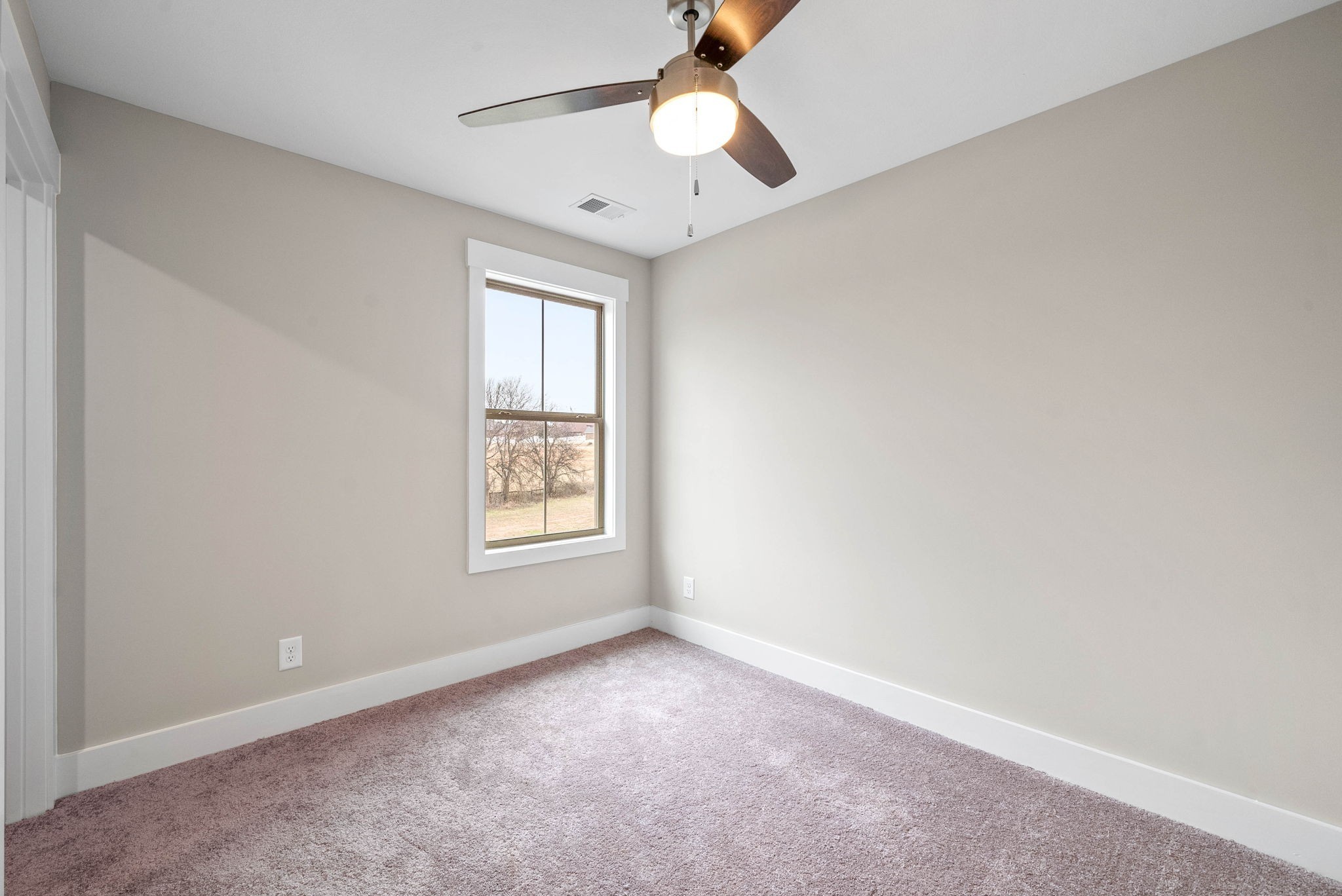 1592 Collins View Way Clarksville, TN 37043 - Photo 28 of 32 an empty room with a window and a fan