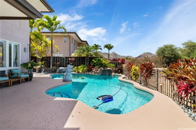 a view of a swimming pool with a patio