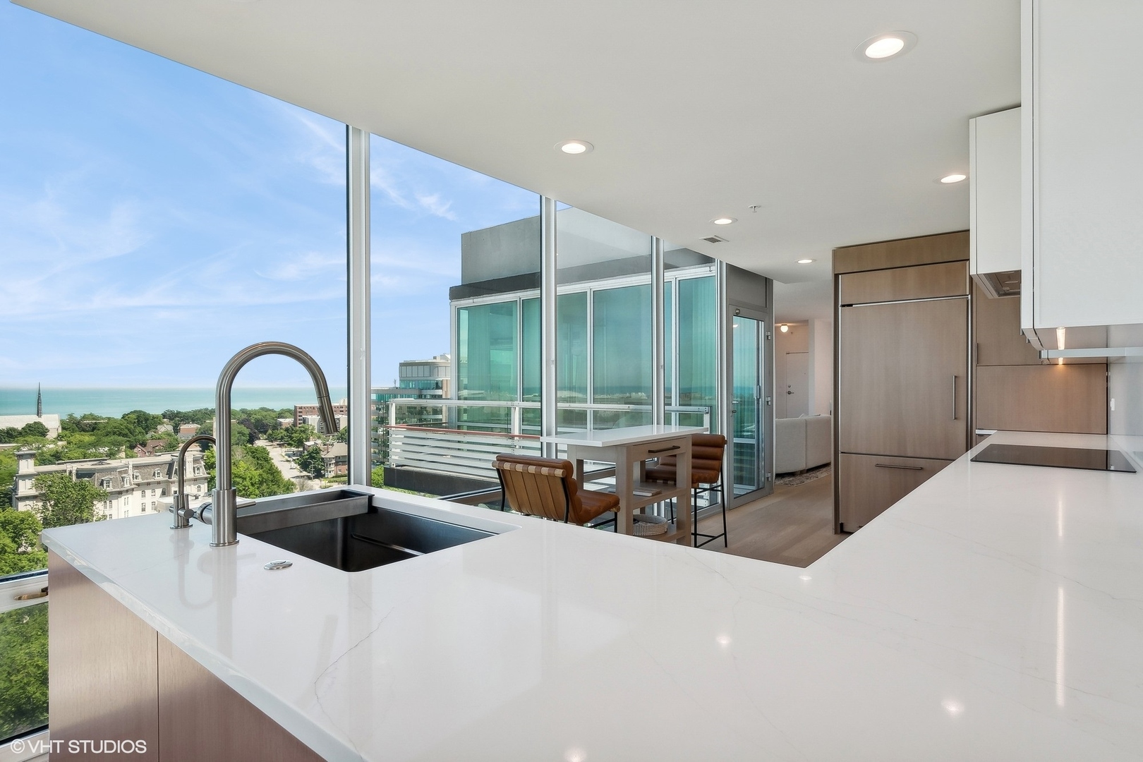 800 Elgin Road, Unit PH02 Evanston, IL 60201 - Photo 12 of 31 a kitchen with a sink and a large window