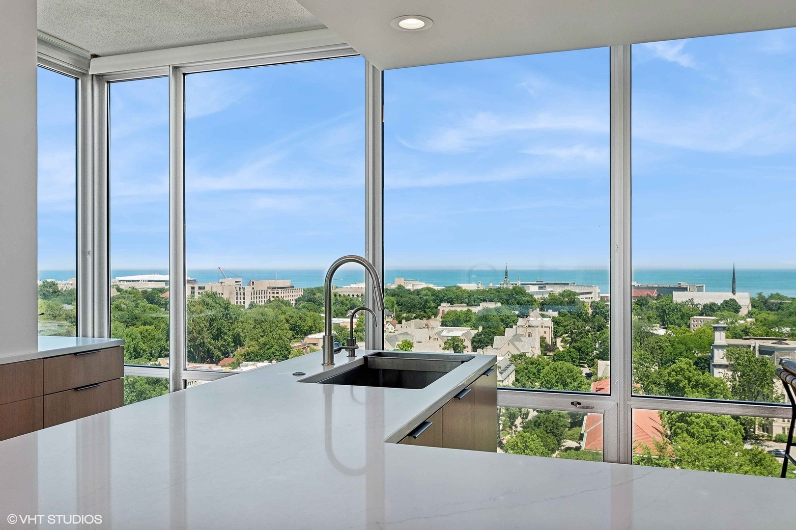 800 Elgin Road, Unit PH02 Evanston, IL 60201 - Photo 13 of 31 a kitchen with a large window and an outdoor view