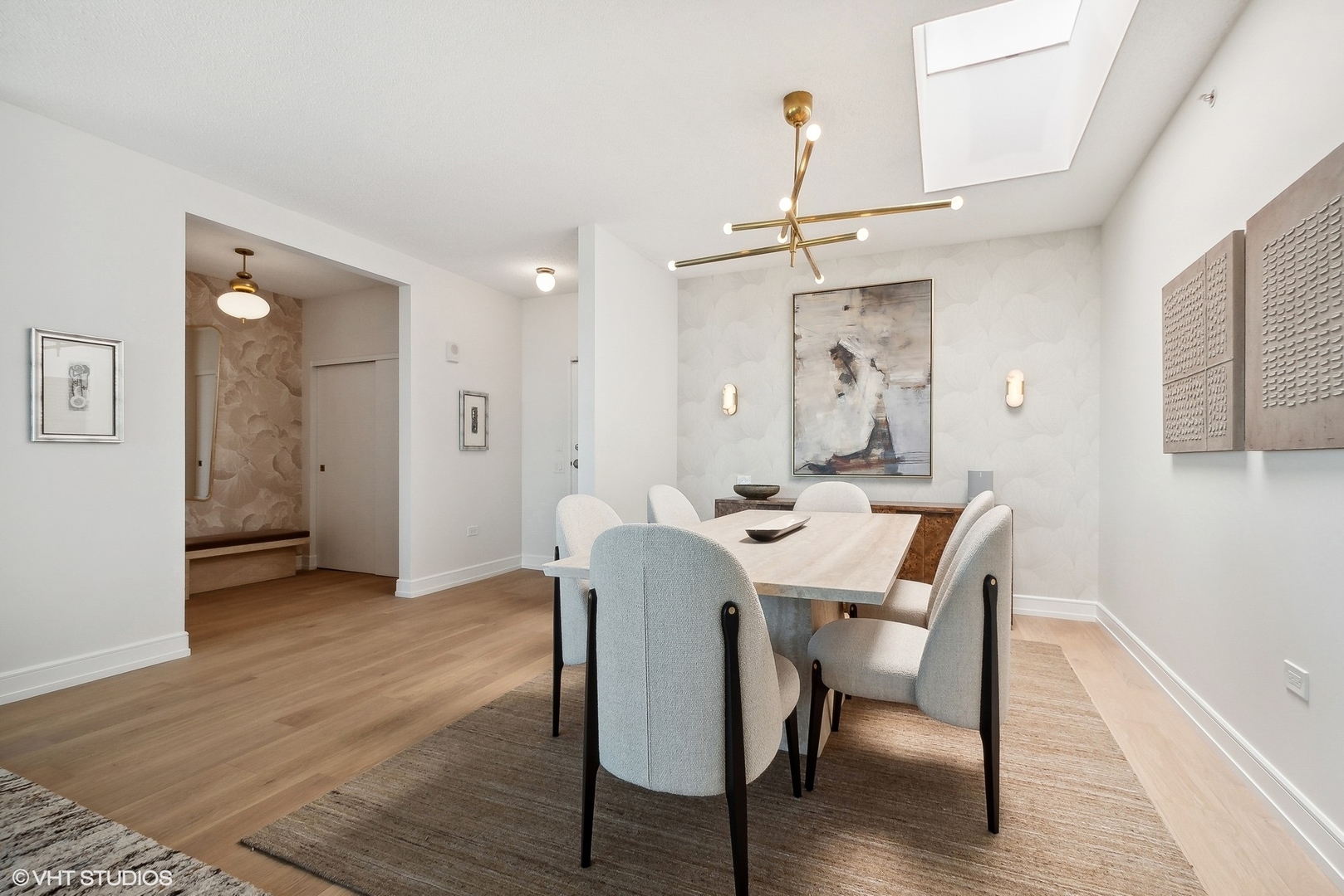 800 Elgin Road, Unit PH02 Evanston, IL 60201 - Photo 14 of 31 a view of a dining room with furniture and wooden floor