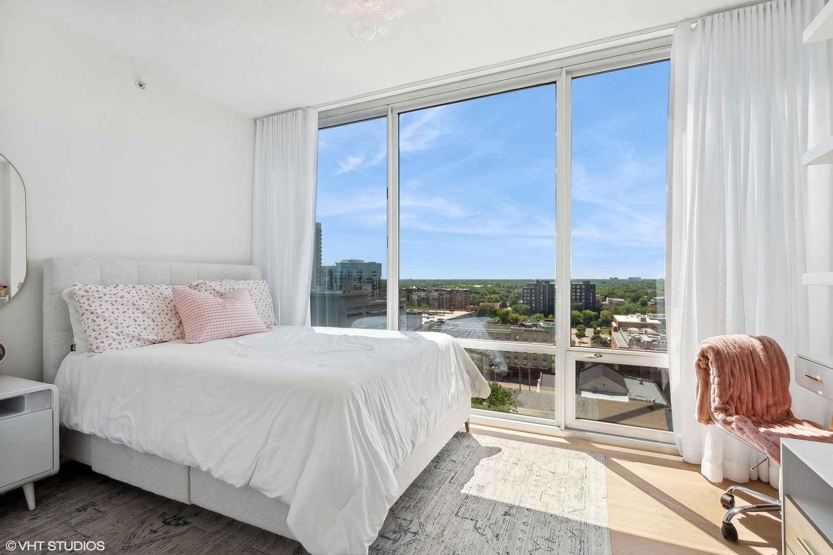 800 Elgin Road, Unit PH02 Evanston, IL 60201 - Photo 20 of 31 a bedroom with a bed and a large window