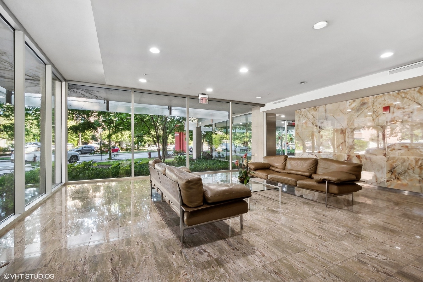 800 Elgin Road, Unit PH02 Evanston, IL 60201 - Photo 2 of 31 a living room with furniture and a large window