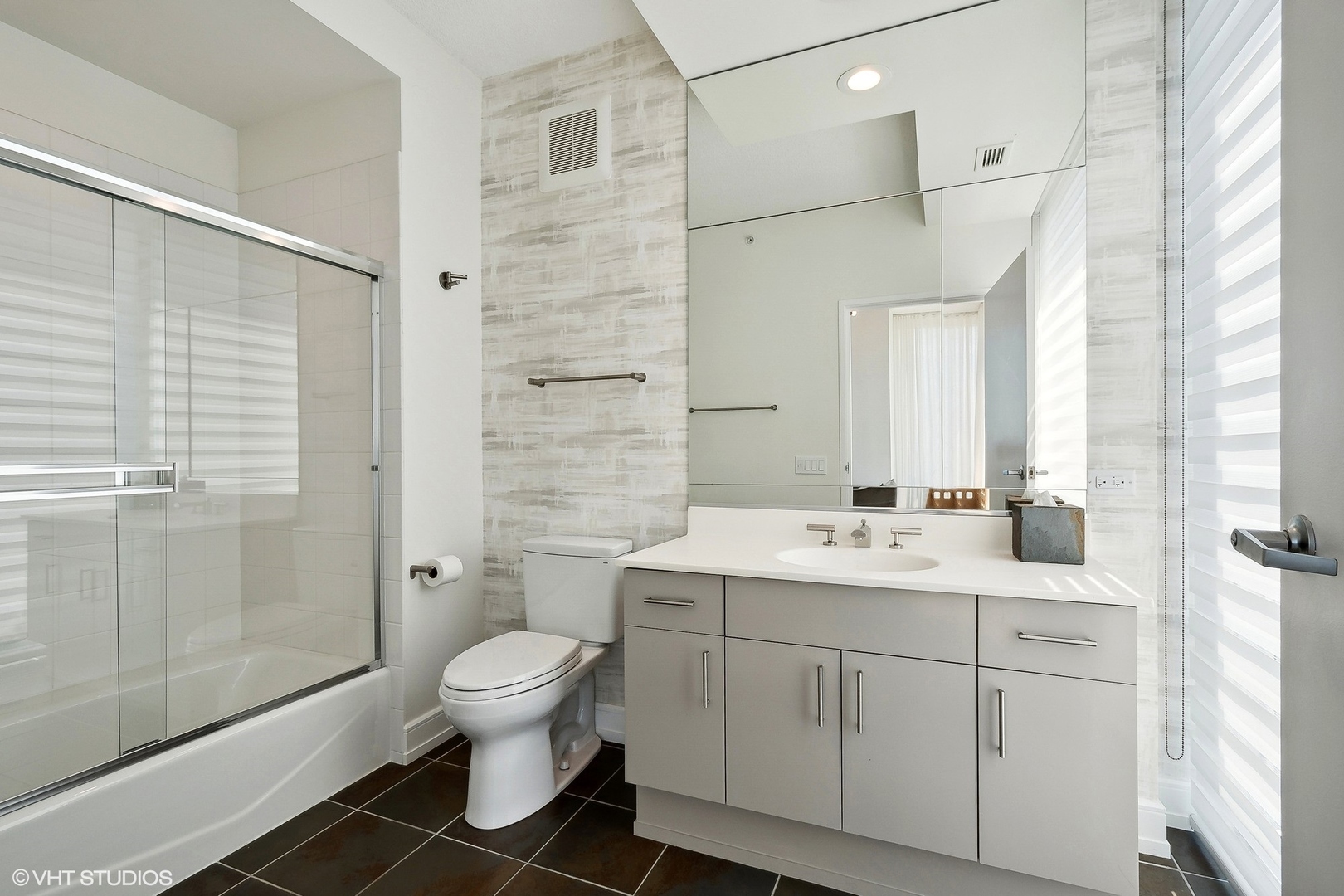 800 Elgin Road, Unit PH02 Evanston, IL 60201 - Photo 22 of 31 a bathroom with a double vanity sink toilet and shower
