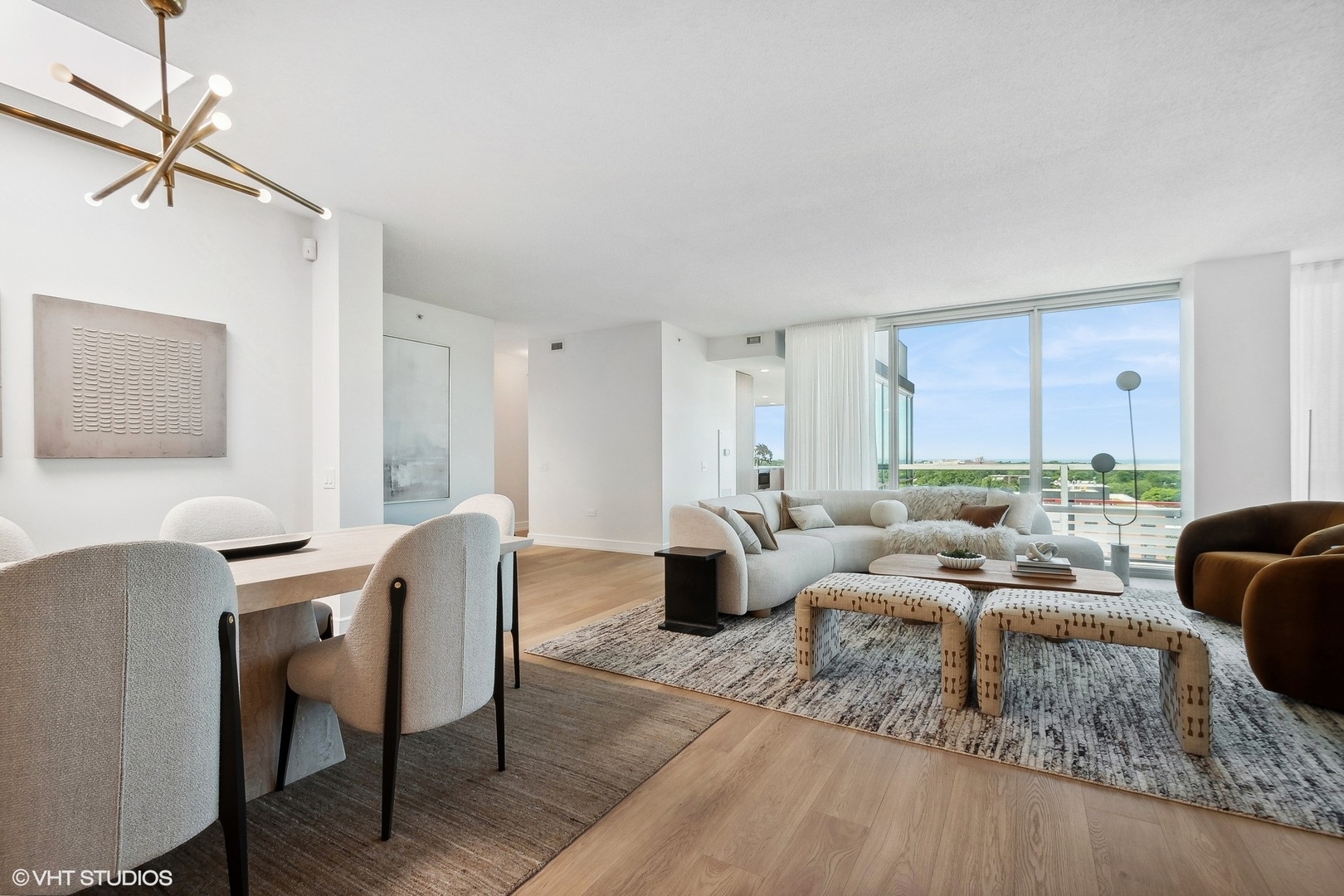 800 Elgin Road, Unit PH02 Evanston, IL 60201 - Photo 7 of 31 a living room with furniture wooden floor and a large window