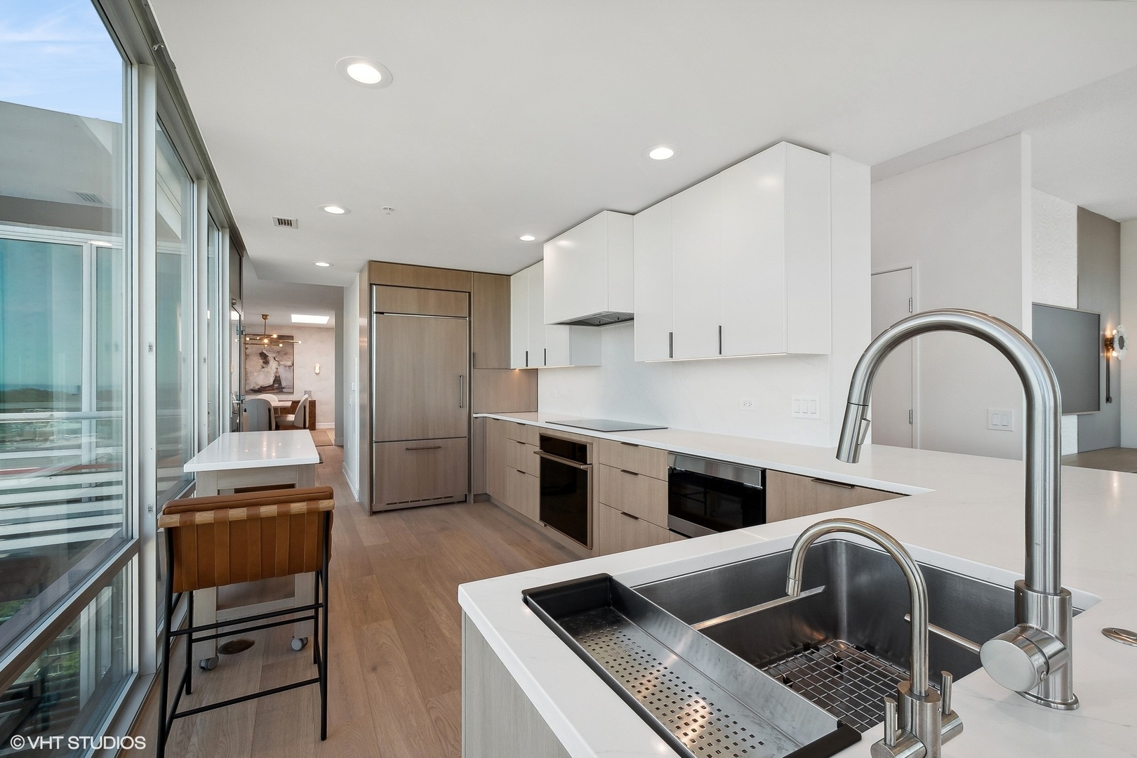 800 Elgin Road, Unit PH02 Evanston, IL 60201 - Photo 9 of 31 a kitchen with a sink cabinets and stainless steel appliances