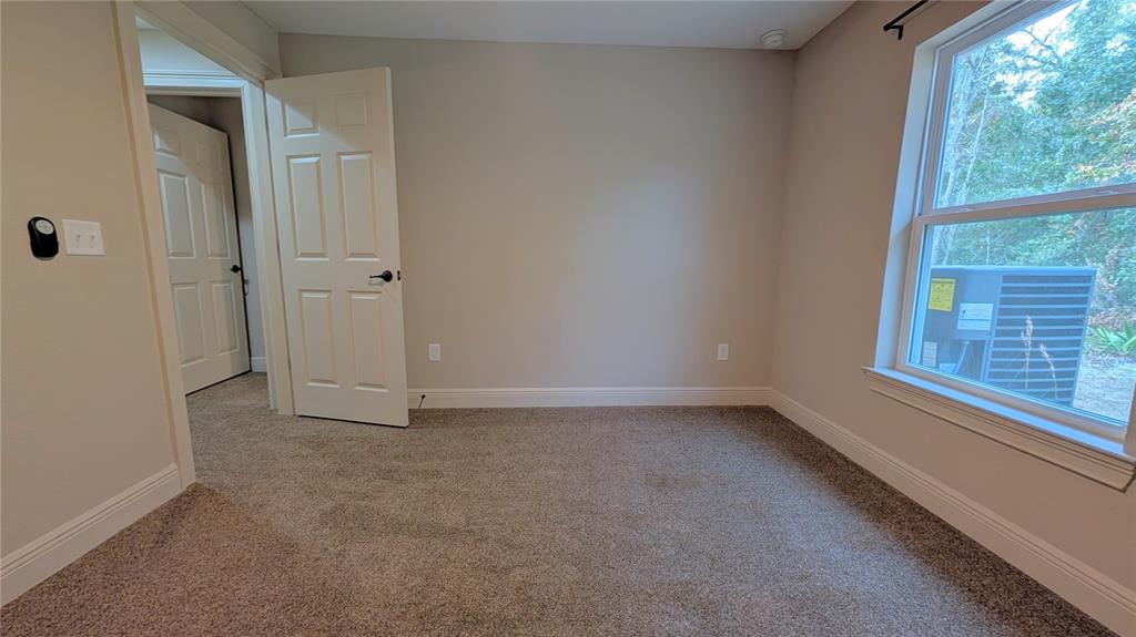 8802 Southwest 135th Place Ocala, FL 34473 - Photo 13 of 39 a view of an empty room with a window