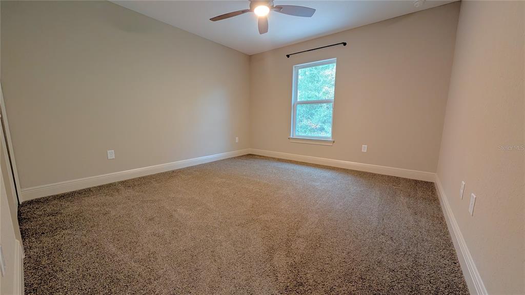 8802 Southwest 135th Place Ocala, FL 34473 - Photo 15 of 39 an empty room with a window