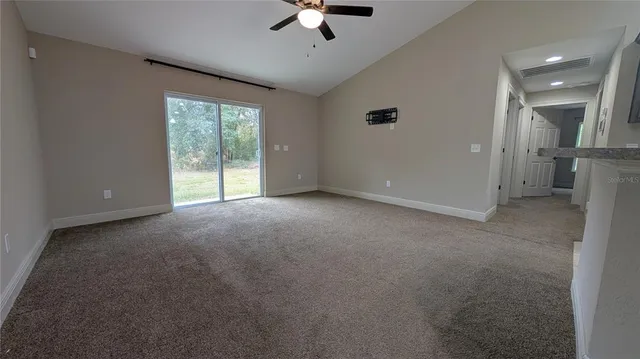 a view of a kitchen with refrigerator stove and a sink