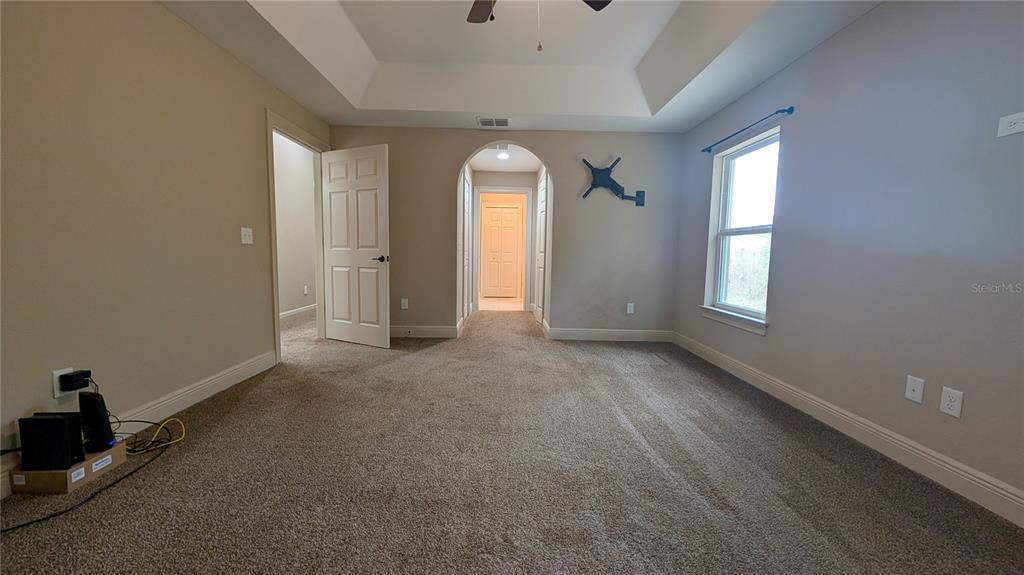 8802 Southwest 135th Place Ocala, FL 34473 - Photo 28 of 39 an empty room with windows and closet