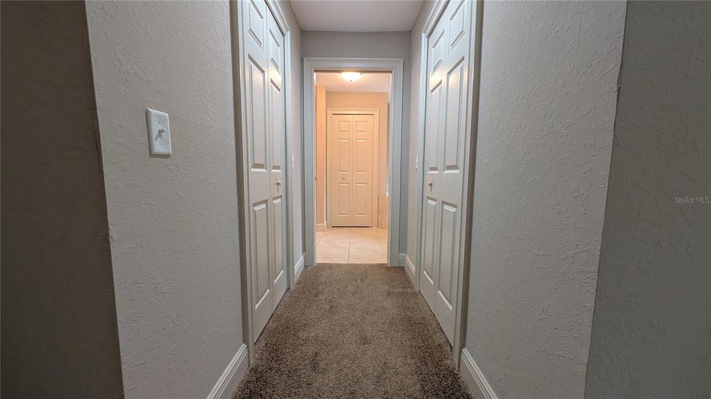 8802 Southwest 135th Place Ocala, FL 34473 - Photo 29 of 39 a view of a hallway with wooden floor
