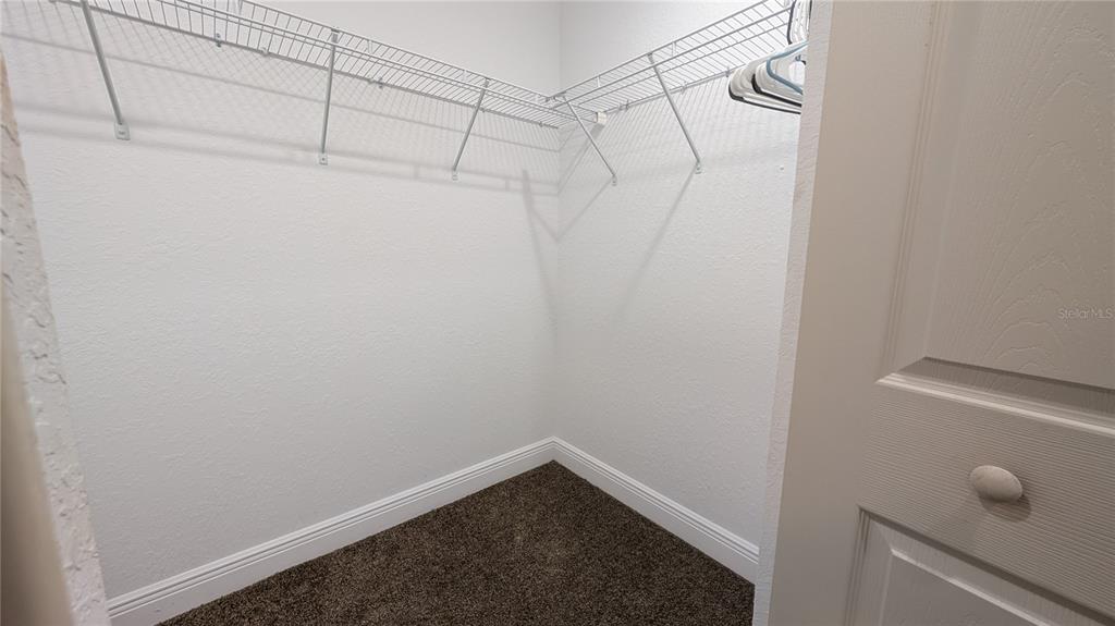 8802 Southwest 135th Place Ocala, FL 34473 - Photo 31 of 39 a view of a room with racks on the wall