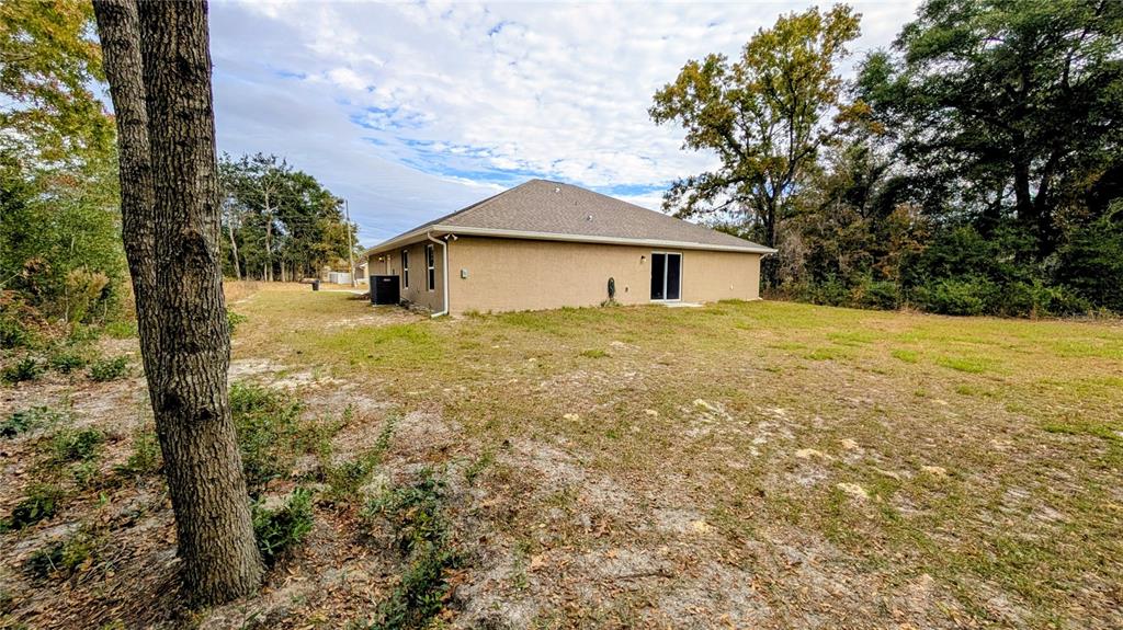 8802 Southwest 135th Place Ocala, FL 34473 - Photo 39 of 39 a view of a house with a yard