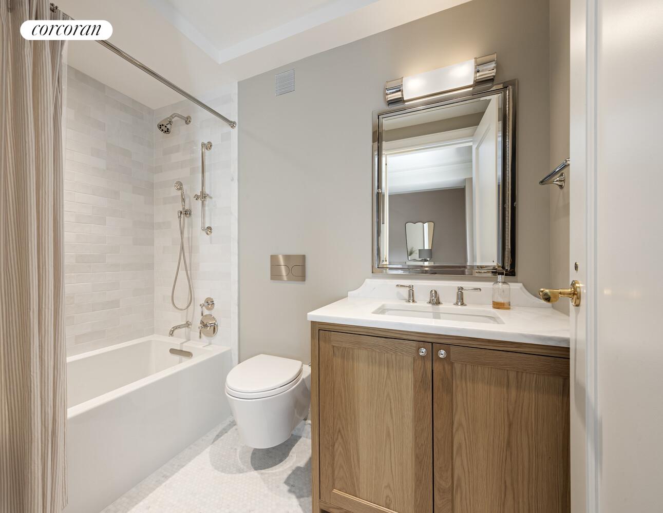 118 West 13th Street, Unit 3 Manhattan, NY 10011 - Photo 27 of 31 a bathroom with a sink a toilet and a mirror