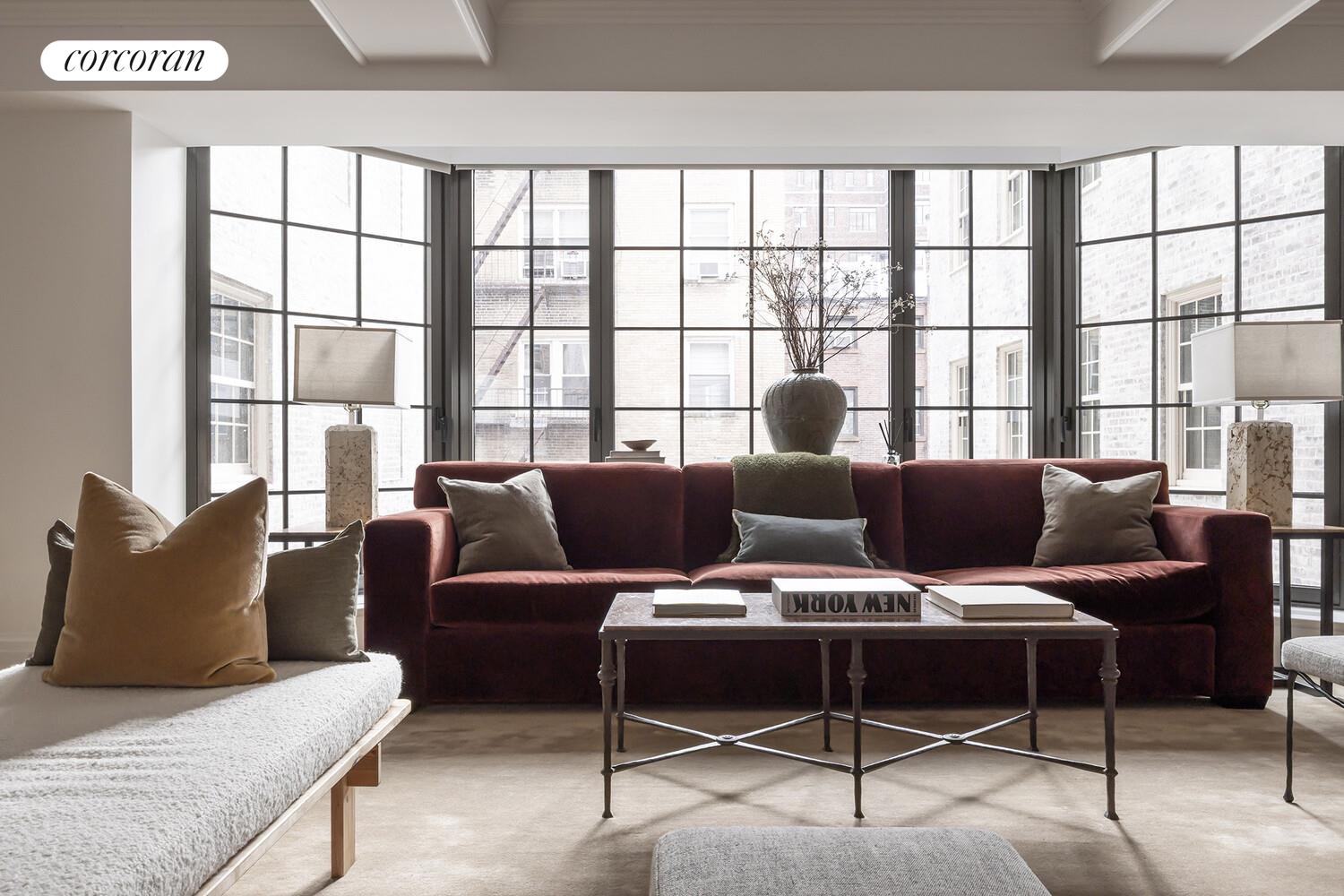 118 West 13th Street, Unit 3 Manhattan, NY 10011 - Photo 2 of 31 a living room with furniture and large windows