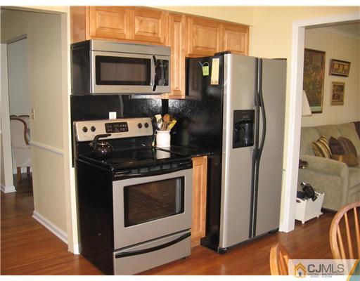 18 Taylor Road Princeton, NJ 08540 - Photo 3 of 20 a kitchen with stainless steel appliances granite countertop a refrigerator stove and microwave